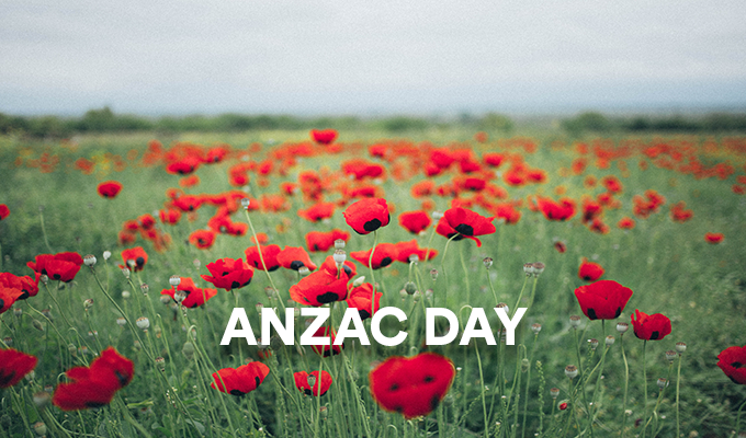 Image of poppy field with the words ANZAC DAY